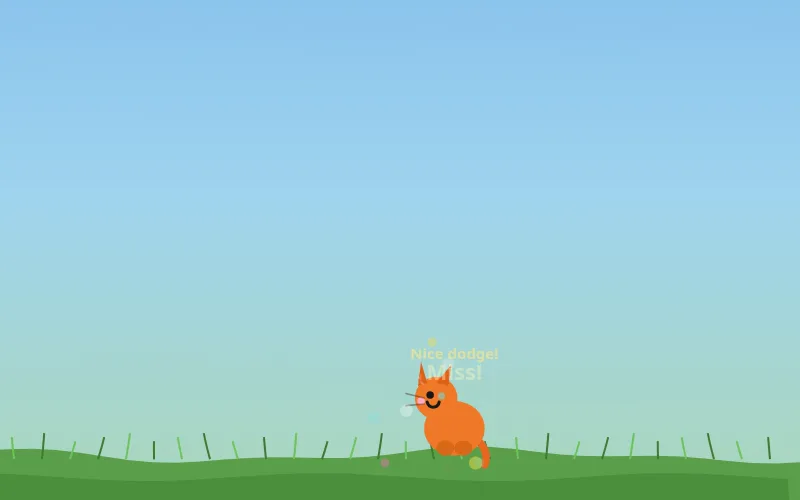 Close-up of the cat with Nice dodge! and Miss! above it and a few confetti dots around